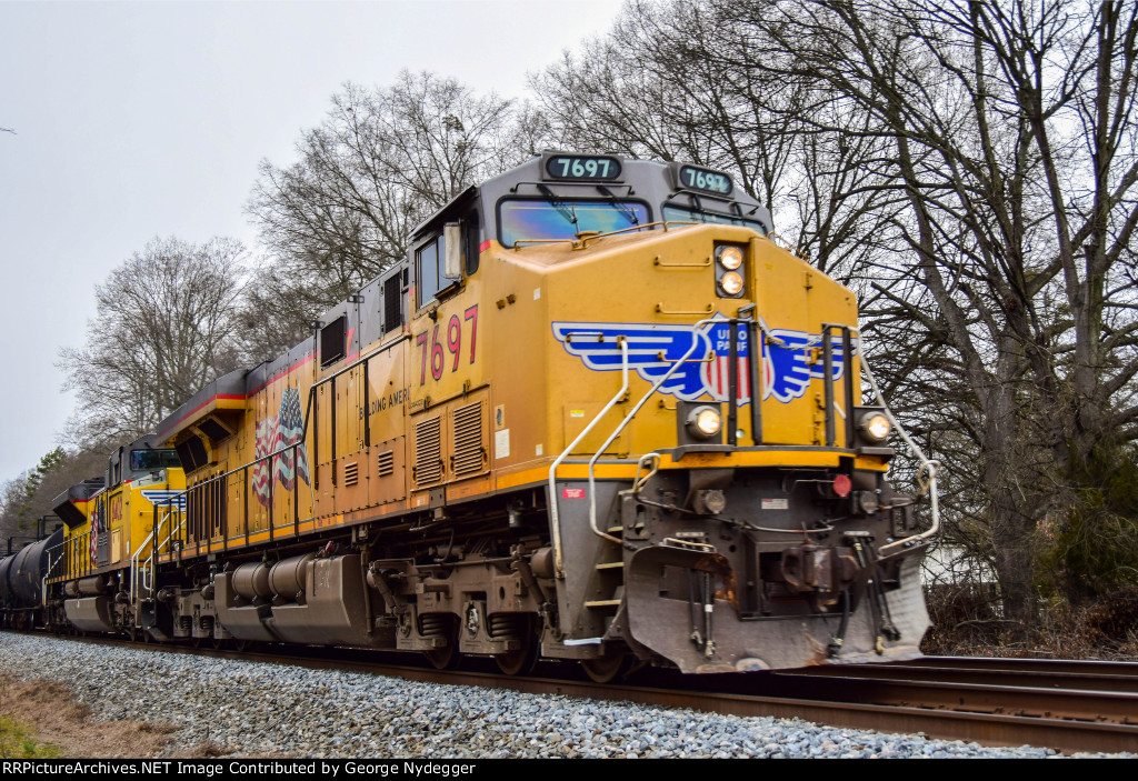 UP 7697 / AC45CCTE is leading a fast mixed freight train